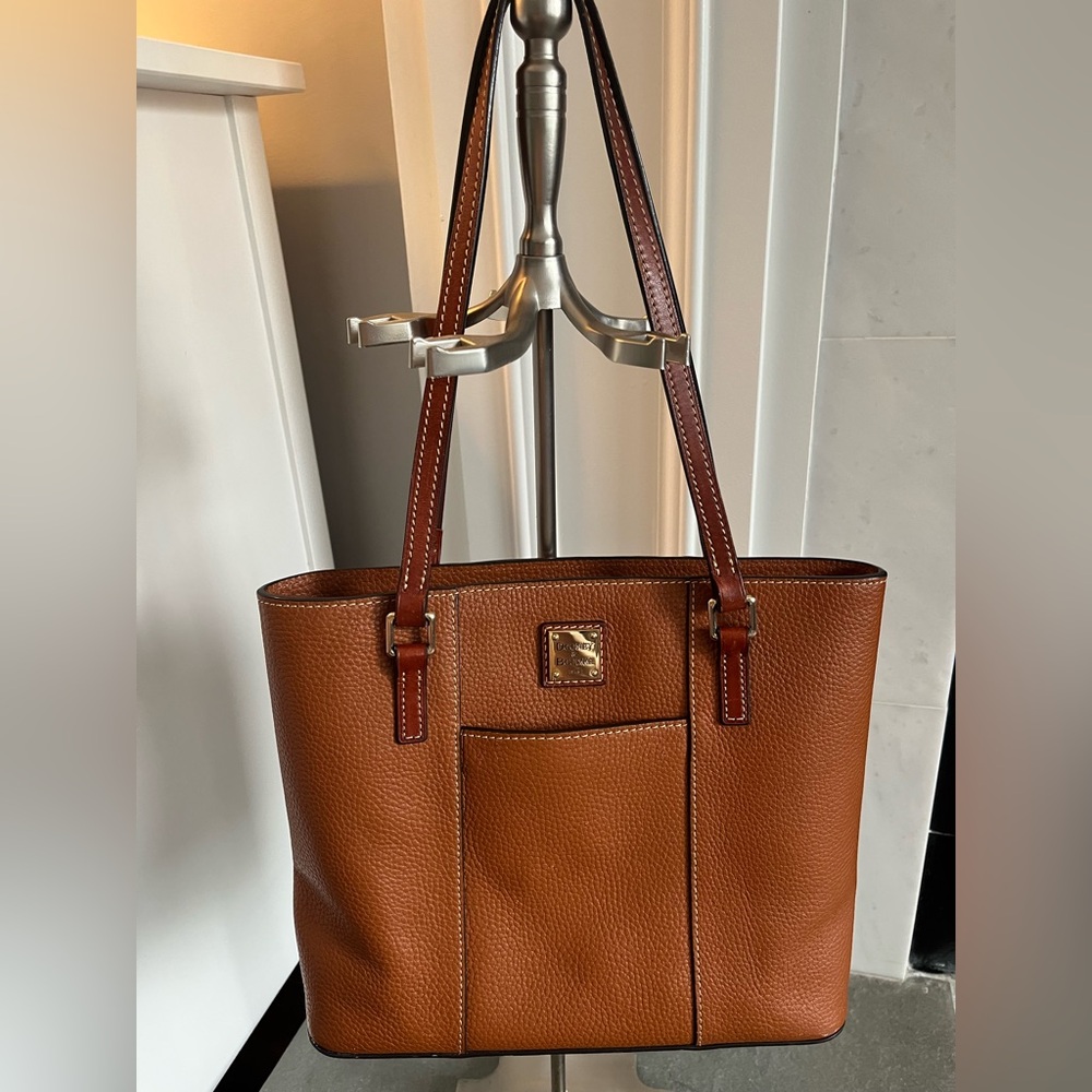 Brown leather Dooney & Bourke with red interior